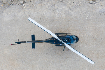 Aerial view of Black Helicopter on a desert ground   © Roi