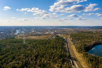 A panorama of the outskirts of the city of Ivanovo from a bird's flight on a spring sunny day.