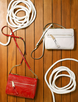 Handbags on a wooden deck