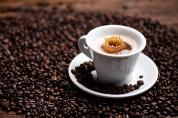 Drops of coffee splashing in a coffe milk, high speed