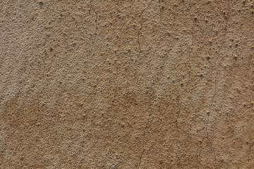 Top view of flat yellow earthy gravel surface texture