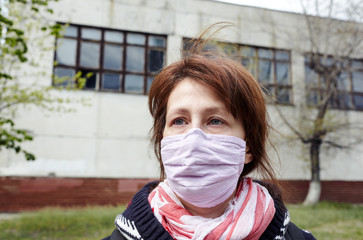 Woman during COVID-19 and flu outbreak with face protection mask. Enjoying nature and sun during quarantine.Concept of coronavirus quarantine. Air pollution