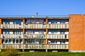 view of a simple rather old three storey apartment building