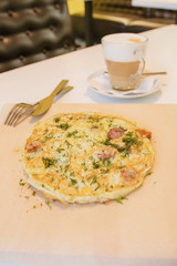 golden omelet with herbs and sausages