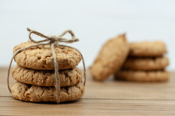 stack of cookies tied with a rope on a wooden background