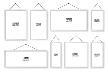 Realistic hanging on a wall white blank picture frames collection. Modern poster mockup. Empty photo frame. Vector illustration.