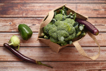 fresh vegetables in a shopping bag on table 