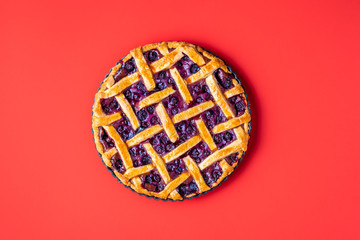 Blueberry pie in a tray with a lattice crust. Classic american pie