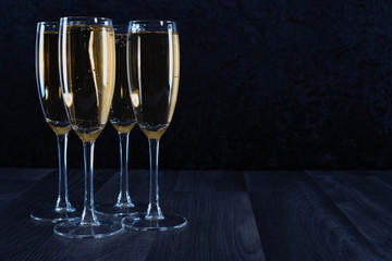 glasses filled to the brim with champagne
