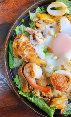 Stir-fried fresh rice-flour noodles with seafood and egg , thai food (Kuaitiao khua talay )