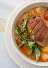 Kaeng Pled Ped Yang (Roasted Duck in Red Curry with tomato,pineapple,Lychee prepared in coconut milk).