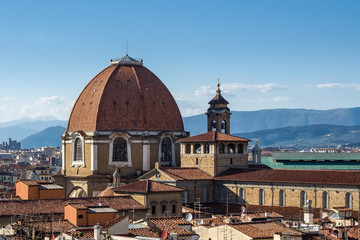 Fototapeta premium The dome of the Cappella dei Principi dominates the San Lorenzo architectural complex (Medici Chapels). Aerial view from Giotto's Campanile. Florence, Tuscany, Italy.