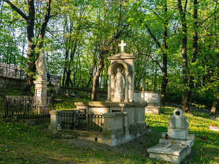 Fototapeta na wymiar Old cemetery in Podgorze. Tombs of famous people form Cracow. Poland