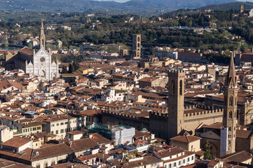 Fototapeta na wymiar The Basilica di Santa Croce (Basilica of the Holy Cross) is the principal Franciscan church. Palazzo del Bargello and Badia Fiorentina. Aerial view from Giotto's Campanile. Florence, Tuscany, Italy.