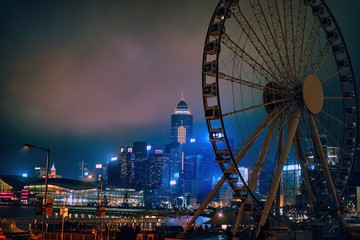 Hong Kong, China; Dic 3 2017: Skyline and Ferris wheel at night