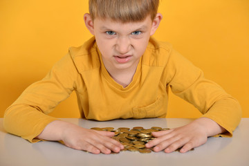 The greedy child took all the coins for himself and does not want to share with anyone.