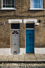 Colourful doors and brick facade in Portobello Street, London