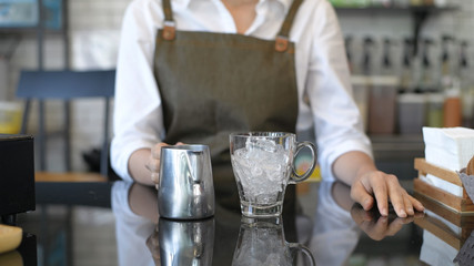 Barista concept. Woman making tea at a bar in a coffee shop. 4k Resolution.