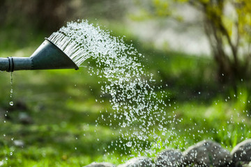 Spring summer garden watering. Water saving ecology gardening background