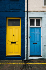 Fototapeta na wymiar Colourful doors and brick facade in Portobello Street, London