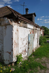 The wall is not a large, old, abandoned building on a summer day.