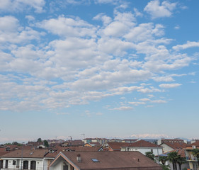 blue sky with clouds and urban skyline