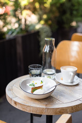 Dessert and Coffee Served on Garden Table Outdoors