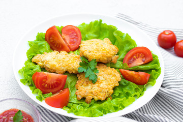Chopped chicken meatballs on lettuce leaves. Baked chicken fillet cutlets. Dietary dish. Concept of shooting food for the menu. The dish of the restaurant. Beautiful serving of food.