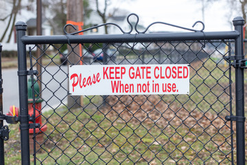warning sign on fence