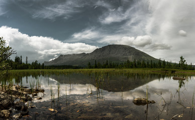 The mountains landscape, reflection of clouds in lake. Hemsedal, Norway.