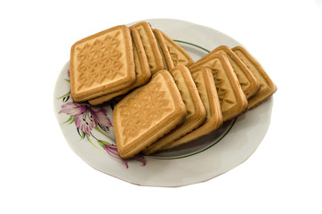 shortbread cookies in a plate isolated on white background.