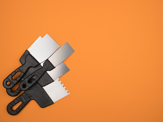 Tool for plastering and painting works. Orange background.