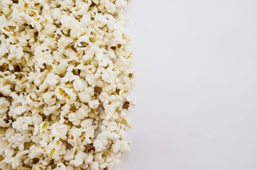 popcorn on a white background. Copy space. The image is divided into two parts.