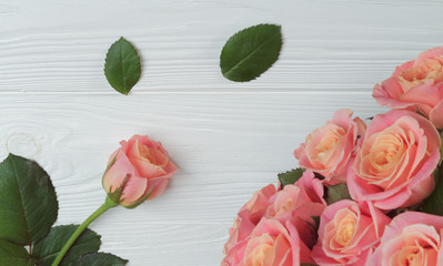 Greeting card with Rose flowers bouquet on white wooden table with copy space