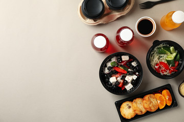Food delivery. Food in takeaway boxes on gray background