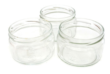 glass small jars isolated on white background. Close-up.