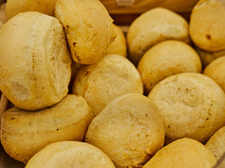 Freshly baked bread on trays in a self-catering supermarket.