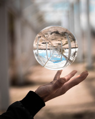 Crystal ball levitating over boy's hand