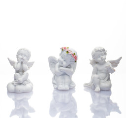 Guardian angel over white background. Christmas decoration. Angelic cupid statue 
