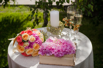 Wedding ceremony decoration. The wedding bouquet. Champagne and two glasses.