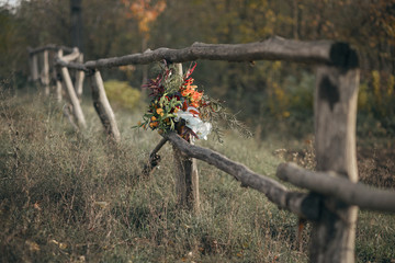 Wedding bouquet with hydrangea, orchid, gloriosa and roses. Boho style.