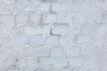 Wall with silicate brick aged with crashed plaster