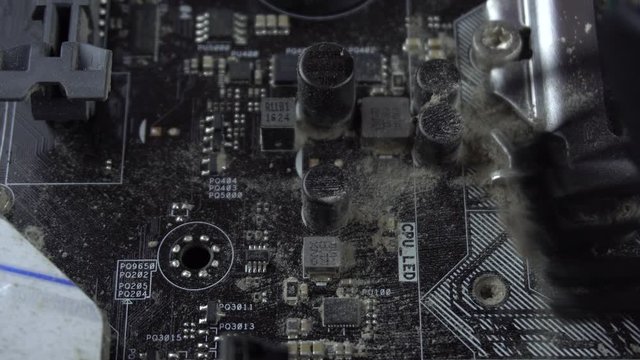 Dust pollution. Cleaning the motherboard from dust. Antistatic brush. 4k.