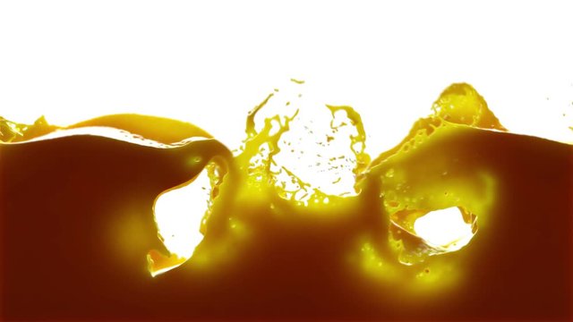 orange juice splash in slow motion