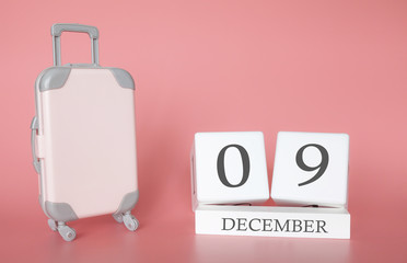 Calendar wooden cube. December 09, time for a winter holiday or travel, vacation calendar