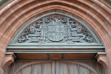 Heraldic Carving above Arched Stone Doorway  of Church Building 