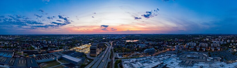 Naklejka na ściany i meble Panoramic aerial drone photo of Katowice at evening