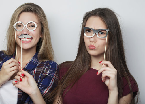 two stylish sexy hipster girls best friends ready for party, over white background