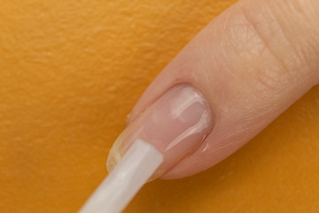 Colorless nail polish that exfoliate