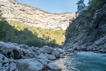 HDR of a gentle stream flowing past a rocky shore in Verdon National Park